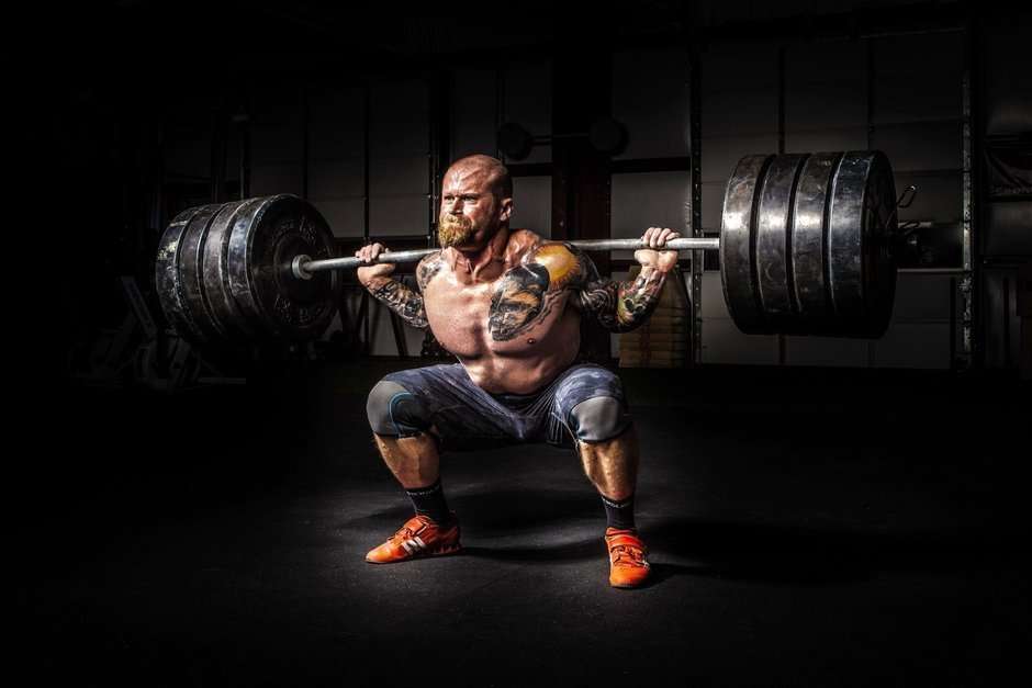Man squatting a heavy barbell
