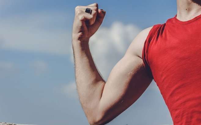 Man's biceps - Red shirt