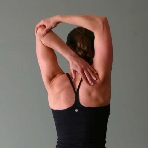 Woman doing a tricep stretch