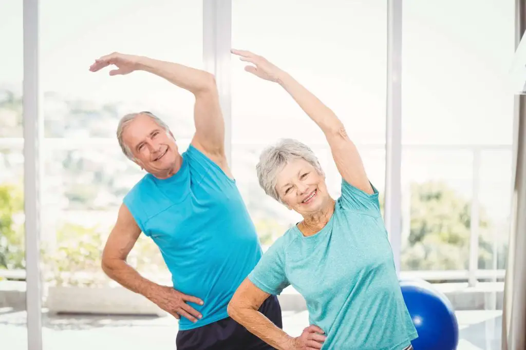 Older couple stretching